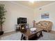 Living room with comfortable seating and large TV at 8403 Grand Estuary Trl # 106, Bradenton, FL 34212