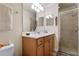 Clean bathroom with double vanity and a walk-in shower at 8403 Grand Estuary Trl # 106, Bradenton, FL 34212