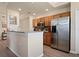 Updated kitchen featuring stainless steel appliances and wood cabinets at 8403 Grand Estuary Trl # 106, Bradenton, FL 34212
