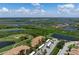 Aerial view of condo community near golf course and waterways at 8403 Grand Estuary Trl # 106, Bradenton, FL 34212