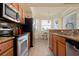 Modern kitchen with stainless steel appliances and granite countertops at 8403 Grand Estuary Trl # 106, Bradenton, FL 34212