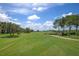 Landscaped golf course with lush green fairways at 8403 Grand Estuary Trl # 106, Bradenton, FL 34212