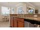 Modern kitchen with stainless steel appliances and granite countertops at 8403 Grand Estuary Trl # 106, Bradenton, FL 34212