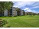Building exterior overlooking a beautiful golf course at 8403 Grand Estuary Trl # 106, Bradenton, FL 34212