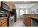 Bright kitchen, stainless steel appliances and granite countertops at 8403 Grand Estuary Trl # 106, Bradenton, FL 34212