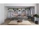 Modern kitchen with gray and white cabinets, large island, and wood floors at 4305 W Zelar St, Tampa, FL 33629