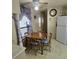 Small dining area with wooden table and chairs at 1710 7Th Sw St # 103, Ruskin, FL 33570