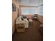 Sunroom features a comfortable sofa and side table, carpeted floor at 1710 7Th Sw St # 103, Ruskin, FL 33570