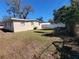 The spacious back yard is enclosed by a mix of wood and PVC fencing at 4305 E Deleuil Ave, Tampa, FL 33610