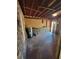 Unfinished basement featuring concrete floors and exposed beams at 4305 E Deleuil Ave, Tampa, FL 33610