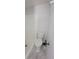 Close-up of a bathroom featuring a toilet, shower, and bathroom accessories at 4305 E Deleuil Ave, Tampa, FL 33610