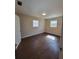Bright bedroom with wood-look floors, neutral walls and natural light at 4305 E Deleuil Ave, Tampa, FL 33610