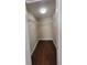 Walk-in closet with metal shelving and wooden floors at 4305 E Deleuil Ave, Tampa, FL 33610