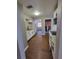 Spacious kitchen features modern appliances, white cabinets and wood flooring at 4305 E Deleuil Ave, Tampa, FL 33610