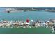 Scenic aerial shot of waterfront homes with private docks, ideal for boating and waterfront living at 831 Bay Point Dr, Madeira Beach, FL 33708