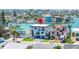 Stunning waterfront home with modern architecture, lush landscaping, and waterfront access at 831 Bay Point Dr, Madeira Beach, FL 33708
