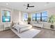 Bright bedroom with a ceiling fan, large windows and light wood flooring at 831 Bay Point Dr, Madeira Beach, FL 33708