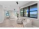 Large suite with water views, sitting area, and ceiling fan at 831 Bay Point Dr, Madeira Beach, FL 33708