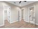 Bedroom with light flooring, white trim and doors to the closet and bathroom at 831 Bay Point Dr, Madeira Beach, FL 33708