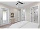 Spacious bedroom featuring multiple doors leading to a closet, bathroom, and a hallway with neutral colors at 831 Bay Point Dr, Madeira Beach, FL 33708