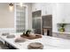 Close-up of the kitchen island, showcasing white countertops and stylish dinnerware at 831 Bay Point Dr, Madeira Beach, FL 33708