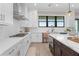 Beautiful kitchen featuring white countertops, stainless steel appliances, and gas range at 831 Bay Point Dr, Madeira Beach, FL 33708