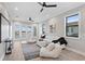 Comfortable living room with water views, TV, ceiling fans, and plush seating at 831 Bay Point Dr, Madeira Beach, FL 33708