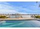 Waterfront pool with a beautiful dock and serene waterfront views at 831 Bay Point Dr, Madeira Beach, FL 33708