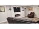 Living room with a modern fireplace and comfortable seating at 5053 N Beach Rd # 9, Englewood, FL 34223