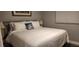 King-size bed, nightstands, and window with blinds in a well-lit bedroom at 5053 N Beach Rd # 9, Englewood, FL 34223