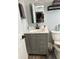 Updated bathroom with gray vanity, marble countertop, and modern fixtures at 5053 N Beach Rd # 9, Englewood, FL 34223