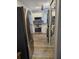 Modern kitchen features stainless steel appliances and wood-look tile floors at 5053 N Beach Rd # 9, Englewood, FL 34223