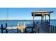 Wooden dock with gazebo offering scenic waterfront views at 5053 N Beach Rd # 9, Englewood, FL 34223
