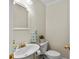 Small half bathroom with pedestal sink and toilet at 2608 W Jetton Ave, Tampa, FL 33629