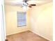 Well-lit bedroom with window blinds and ceiling fan at 11903 Greengate Dr, Hudson, FL 34669