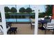Relaxing poolside patio with seating area and covered lanai at 429 Flamingo Dr, Apollo Beach, FL 33572