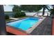 Inviting rectangular pool with surrounding patio and lounge chairs at 429 Flamingo Dr, Apollo Beach, FL 33572