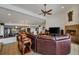 Relaxing living room with a fireplace and leather sectional sofa at 429 Flamingo Dr, Apollo Beach, FL 33572