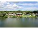 Waterfront property showcasing a canal-side house with dock and landscaping at 429 Flamingo Dr, Apollo Beach, FL 33572