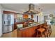 Spacious kitchen with island, stainless steel appliances, and granite countertops at 429 Flamingo Dr, Apollo Beach, FL 33572