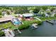 Aerial view showcasing home, pool, dock, and canal at 429 Flamingo Dr, Apollo Beach, FL 33572