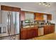 Stainless steel appliances and wood cabinets in this kitchen at 429 Flamingo Dr, Apollo Beach, FL 33572