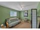 Cozy bedroom with a futon and window seat at 429 Flamingo Dr, Apollo Beach, FL 33572