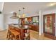Modern kitchen with large island, granite countertops, and wood cabinets at 429 Flamingo Dr, Apollo Beach, FL 33572