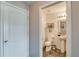 Updated half bathroom features a modern vanity and fixtures next to the door at 228 Star Shell Dr, Apollo Beach, FL 33572