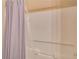 This bathroom features a neutral shower curtain with shower features at 228 Star Shell Dr, Apollo Beach, FL 33572