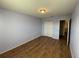 This bedroom features hardwood floors and a double door closet at 228 Star Shell Dr, Apollo Beach, FL 33572