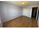 This bedroom features hardwood floors and double door closet at 228 Star Shell Dr, Apollo Beach, FL 33572