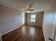 This bedroom features hardwood floors and natural light from the window at 228 Star Shell Dr, Apollo Beach, FL 33572