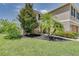 Two story home with a manicured lawn, mature trees, and a sidewalk leading to the front door at 228 Star Shell Dr, Apollo Beach, FL 33572